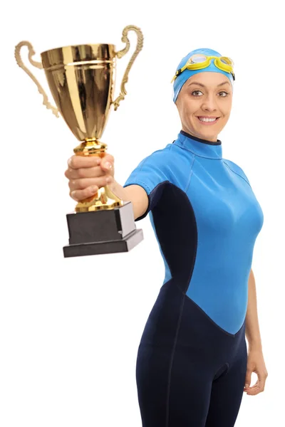 Joyful female swimmer holding a gold trophy — Stock Photo, Image