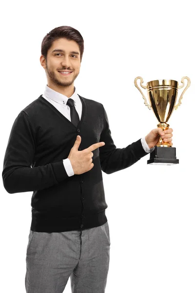 Guy holding a gold trophy and pointing — Stock Photo, Image