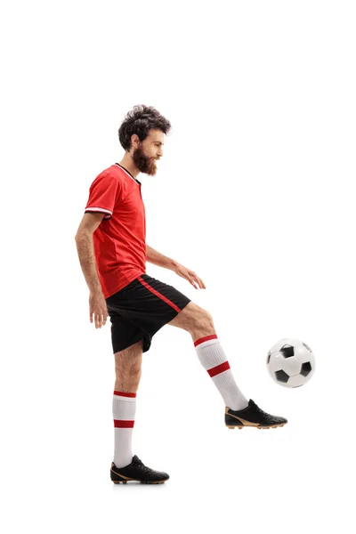 Barbuto ragazzo giocoleria un calcio — Foto Stock