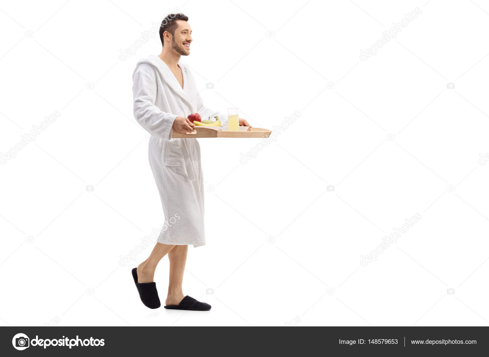 Guy walking and carrying tray with breakfast Stock Photo by