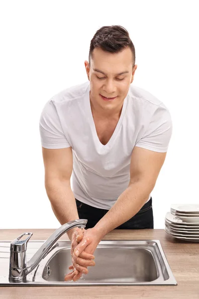 Young man washing his hands — Stock Photo, Image