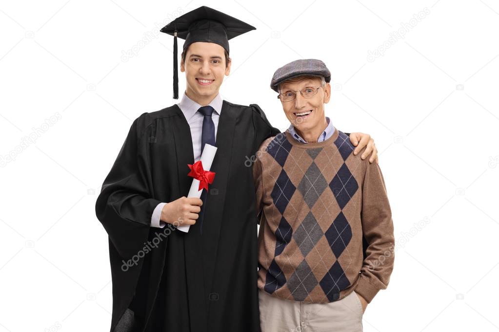 Graduate student and his grandfather looking at the camera