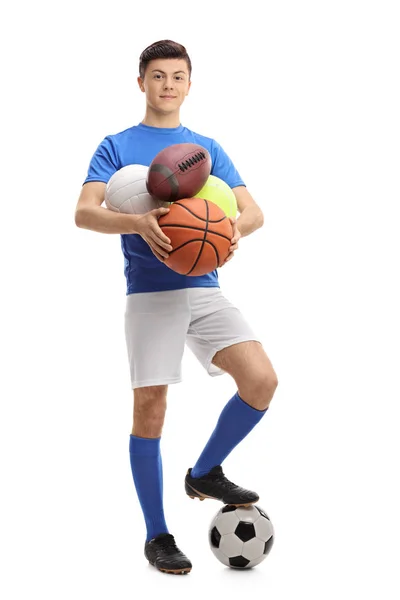 Atleta adolescente com diferentes tipos de bolas esportivas — Fotografia de Stock