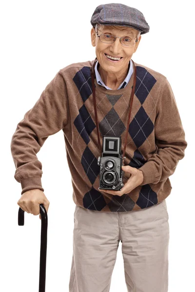 Senior with a vintage camera and a walking cane — Stock Photo, Image