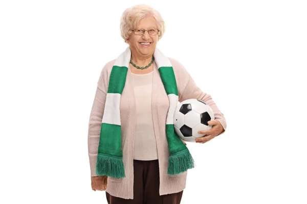 Elderly soccer fan with a scarf and a football — Stock Photo, Image