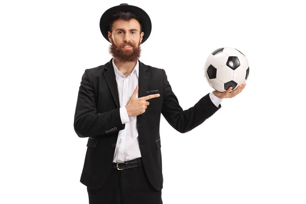 Bearded guy holding a football and pointing — Stock Photo, Image