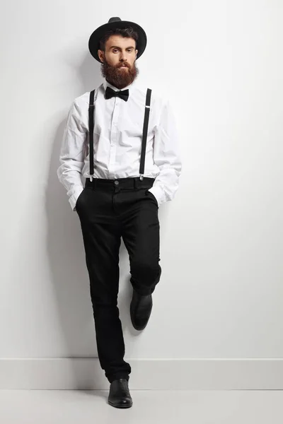 Elegant man with suspenders and a bow tie