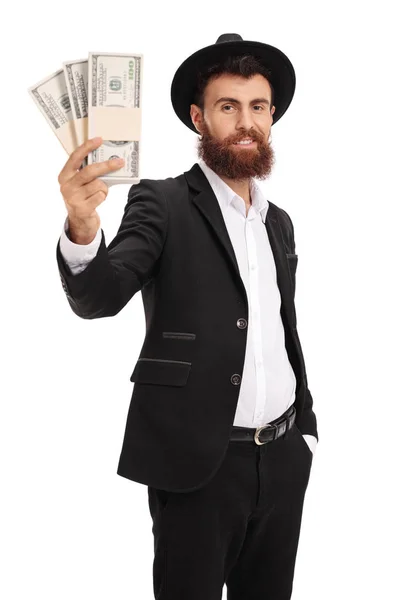 Handsome man holding a money bundle — Stock Photo, Image