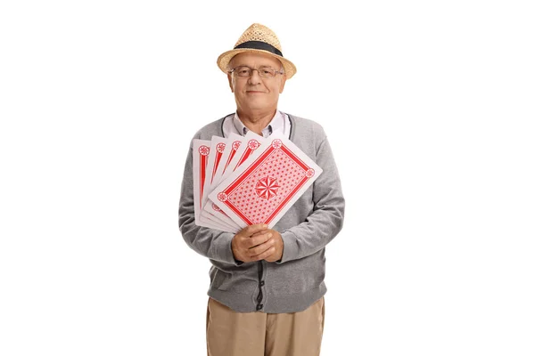 Homme mûr avec des cartes à jouer — Photo