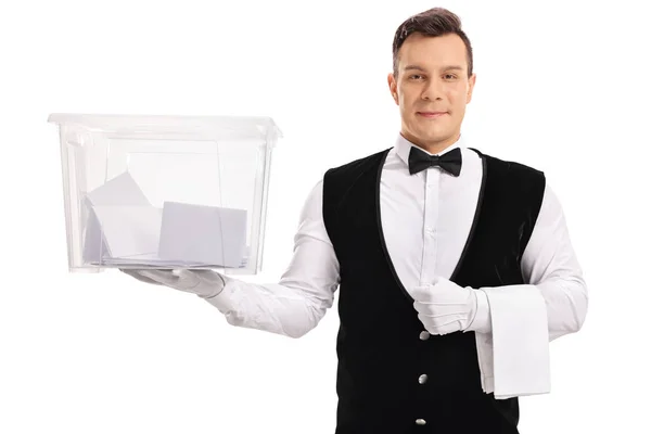 Butler holding a ballot box filled with votes — Stock Photo, Image