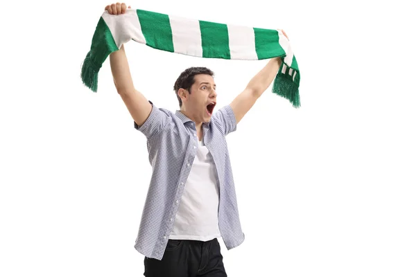 Football fan holding a scarf and cheering — Stock Photo, Image