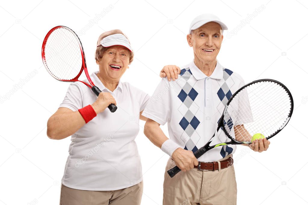 Elderly tennis players smiling