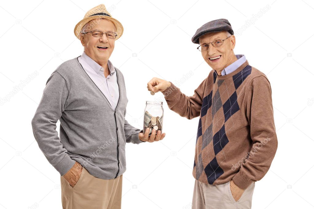 man holding money jar with another man putting coin