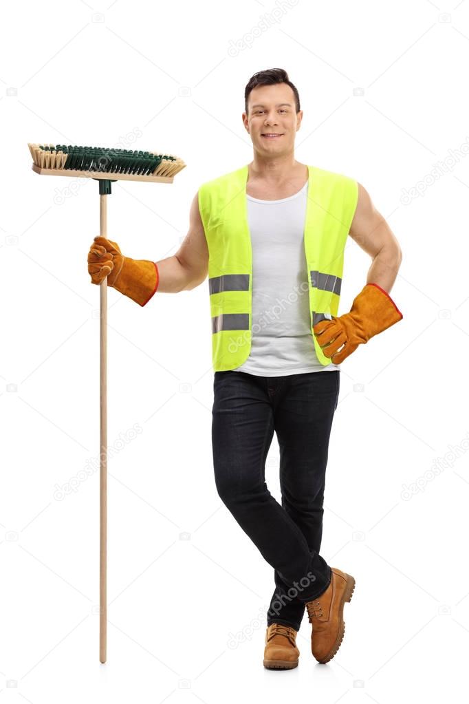 Waste collector with a broom