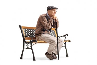 Pensive senior with a walking cane sitting on a bench clipart