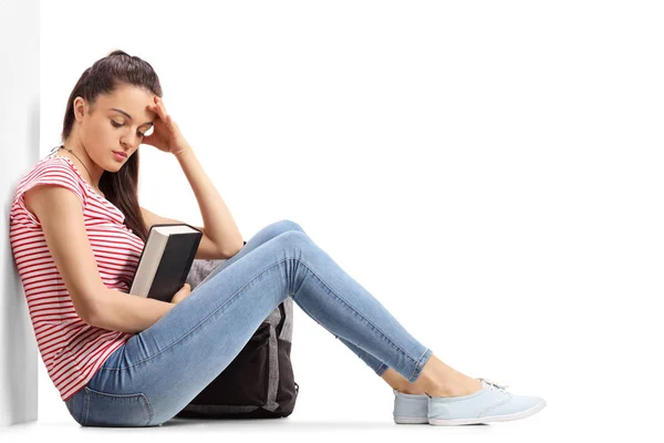 Depressed teenage student sitting on the floor — Stock Photo, Image