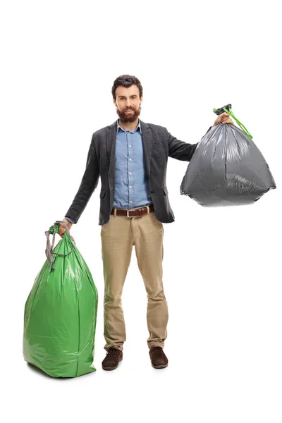 Jeune homme avec des sacs poubelle — Photo