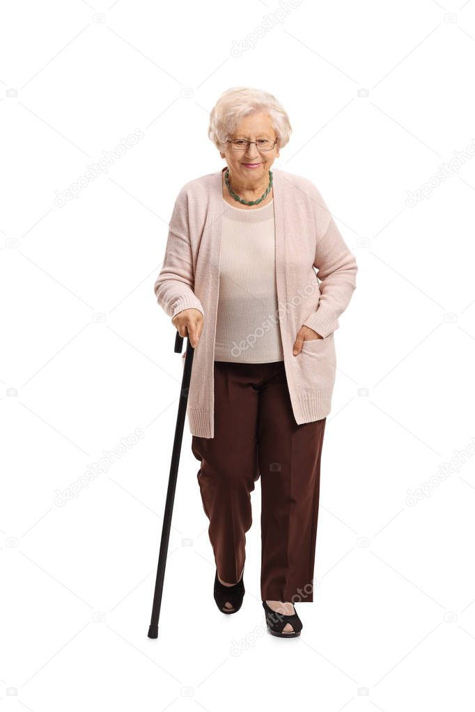 Mature woman with a cane walking