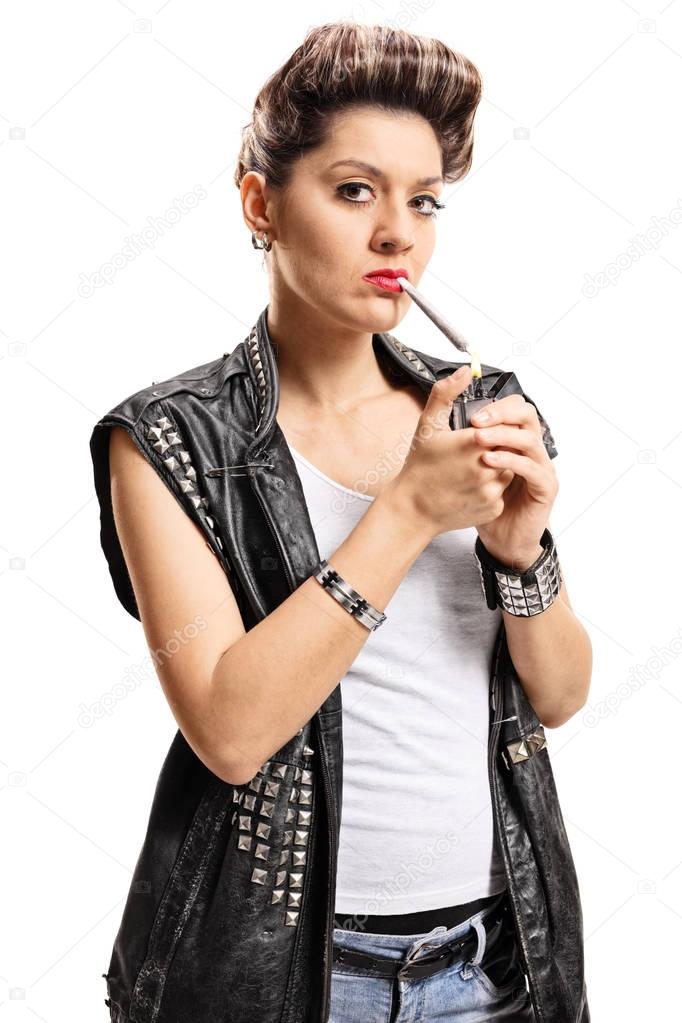 Female punker lighting up a joint with a lighter