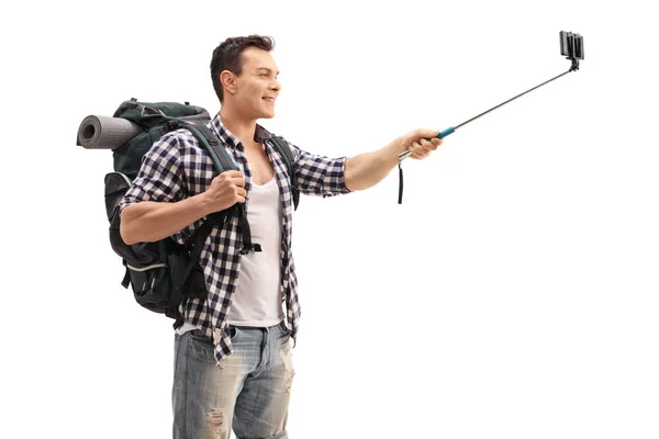 Hiker taking a selfie with a stick — Stock Photo, Image