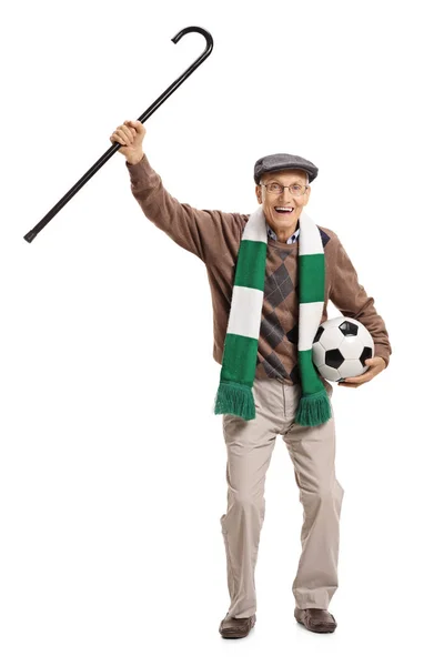 Alegre fanático del fútbol sosteniendo un bastón y animando — Foto de Stock