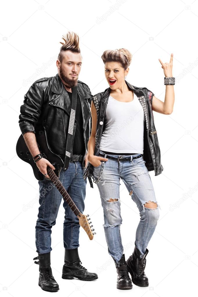 Male punker with a guitar and a female punker