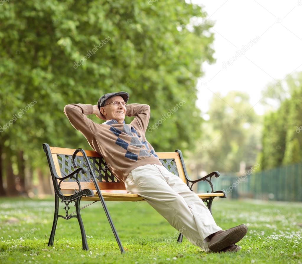 Senior relaxing on a wooden bench