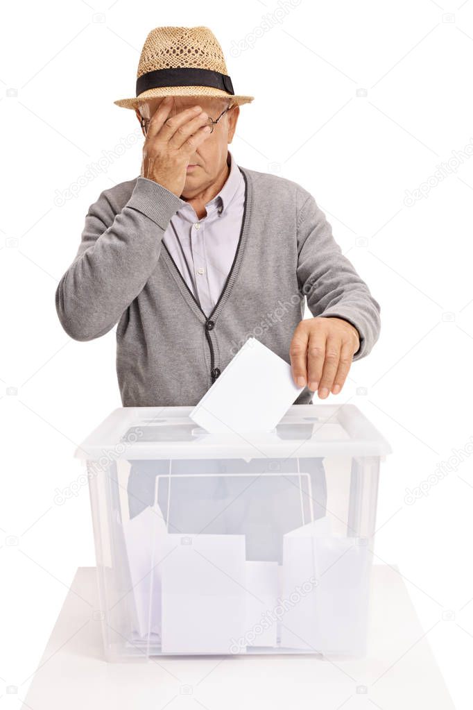 Senior voting and holding his head in disbelief