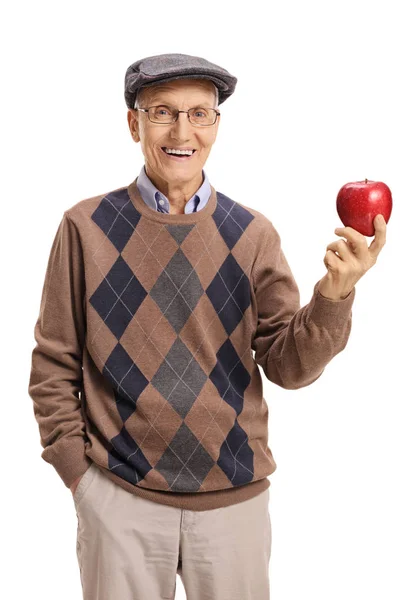 Senior hält einen Apfel in der Hand — Stockfoto