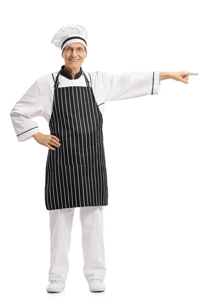 Porträtt av en kock som pekar åt höger — Stockfoto