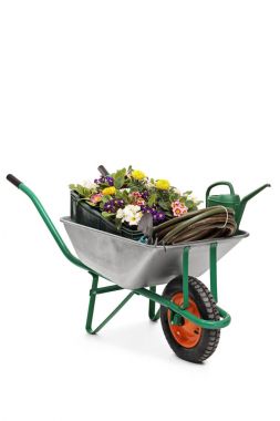 Wheelbarrow filled with flowers and gardening equipment clipart