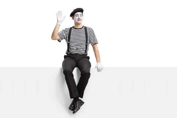 Mime artist sitting on a panel — Stock Photo, Image