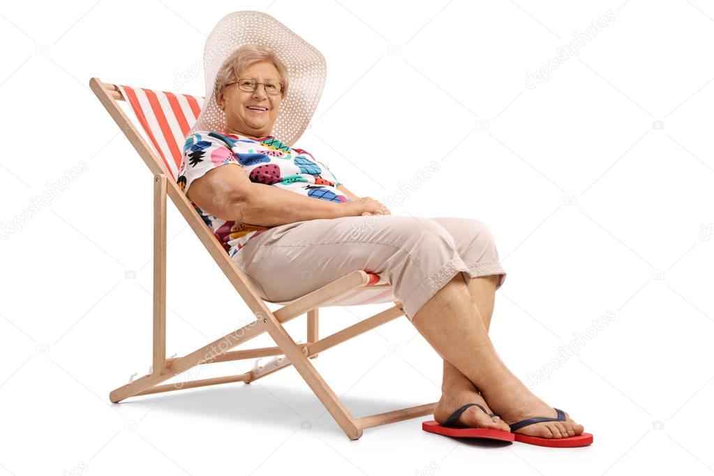 Elderly woman sitting in a deck chair