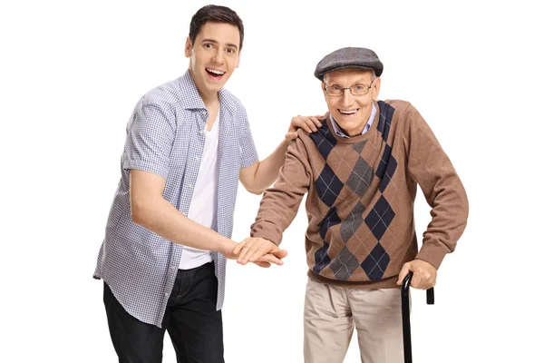 Mannen och en senior att sätta händerna ihop — Stockfoto