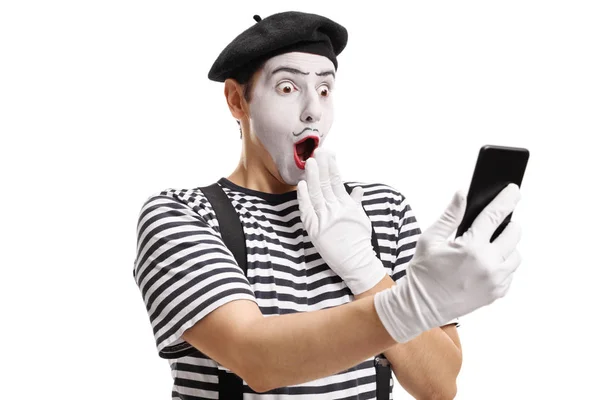 Surprised mime looking at a phone — Stock Photo, Image