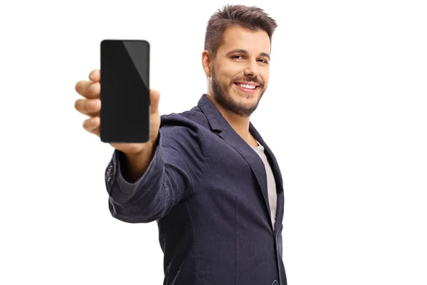 Junger Kerl zeigt ein Telefon — Stockfoto