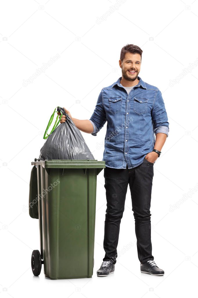 portrait of a guy taking out the garbage