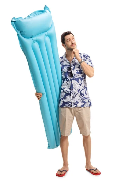 Pensive tourist with an air mattress — Stock Photo, Image