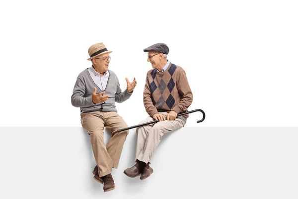 Seniors sitting on a panel and talking — Stock Photo, Image