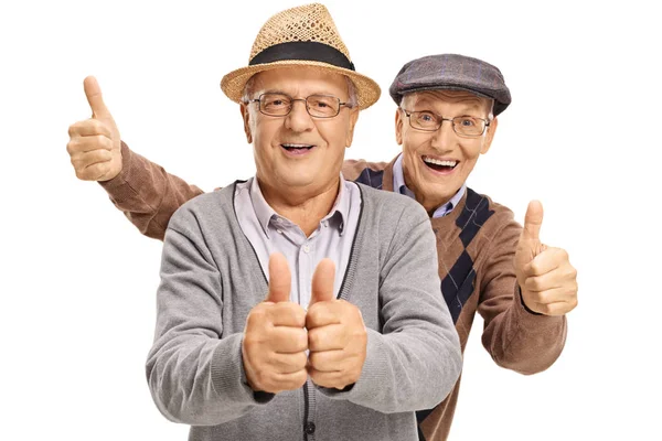 Ancianos sosteniendo sus pulgares hacia arriba — Foto de Stock