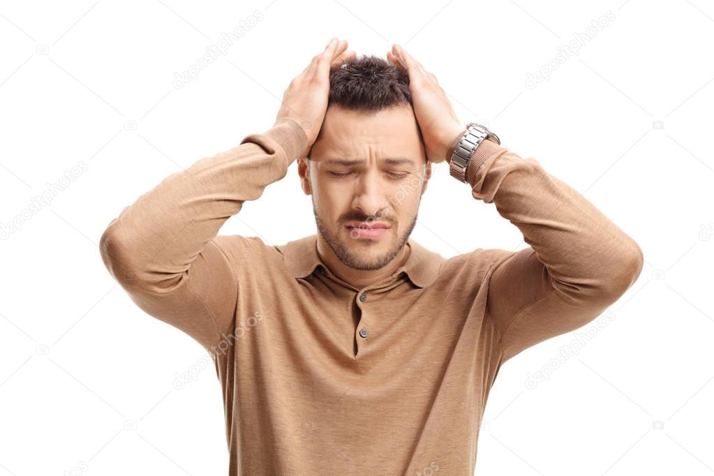 Young guy experiencing headache