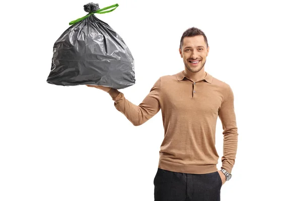 Young man holding a garbage bag — Stock Photo, Image