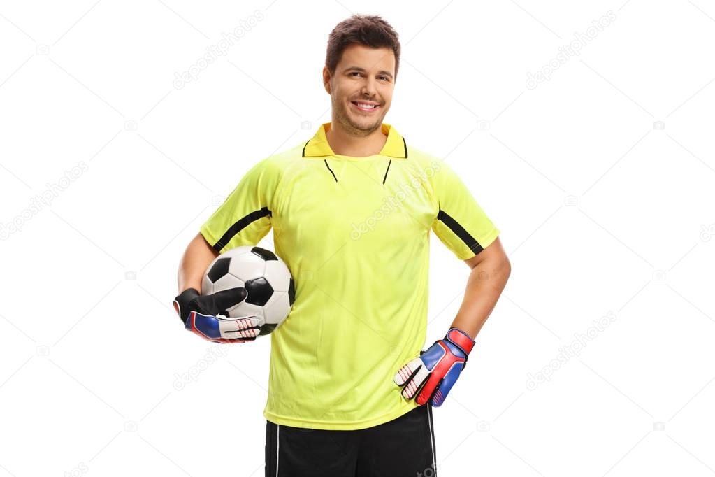 Goalkeeper with a football smiling