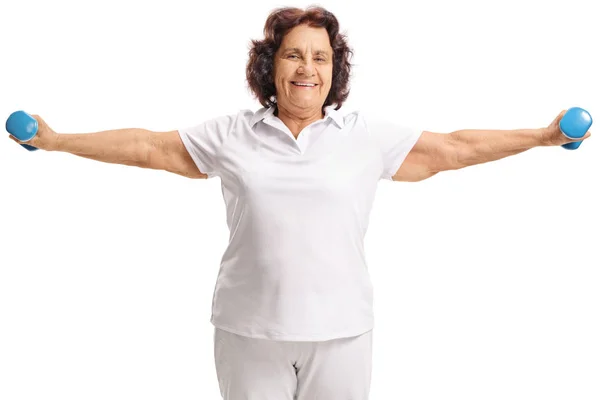 Elderly woman exercising with small dumbbells — Stock Photo, Image