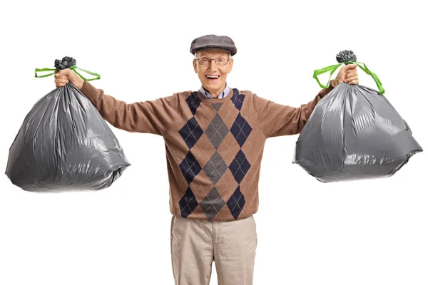 Senior with garbage bags — Stock Photo, Image