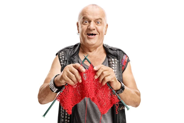 Elderly punker knitting and smiling — Stock Photo, Image