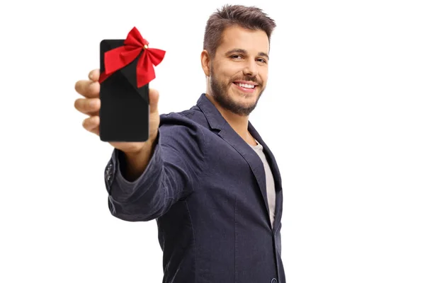 Ragazzo mostrando telefono avvolto con nastro come regalo — Foto Stock