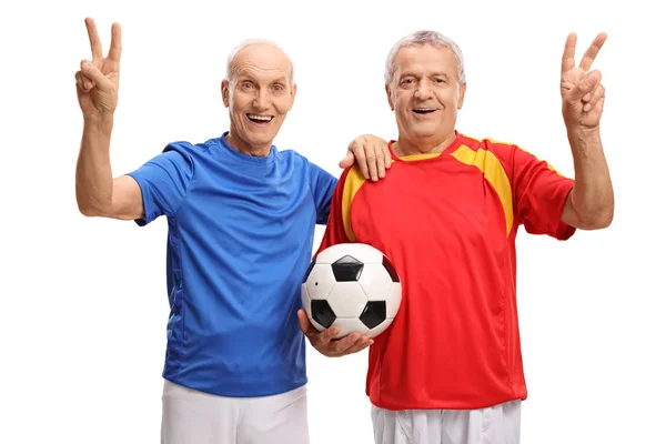 Jugadores de fútbol haciendo señales de victoria —  Fotos de Stock