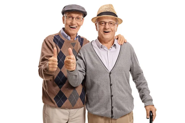 Seniors holding their thumbs up — Stock Photo, Image