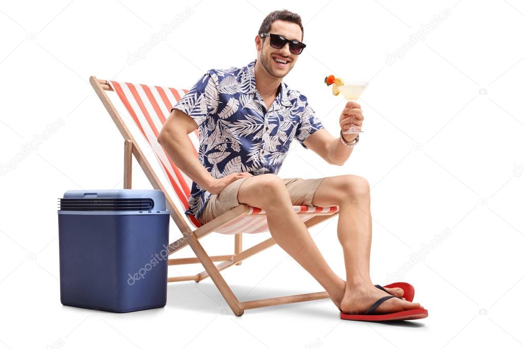 Tourist sitting in deck chair and looking at the camera